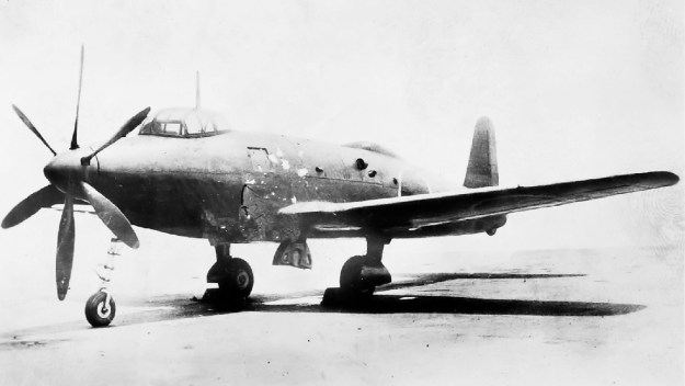The standard image of the Yokosuka R2Y1 Keiun. Speculation suggests the first scoop on the side of the aircraft provided cooling air for the engine's internal exhaust baffling, the second, larger scoop provided induction air for the normally aspirated Aichi [Ha-70] engine installed in the prototype, and the final two ports were for the engine's exhaust.